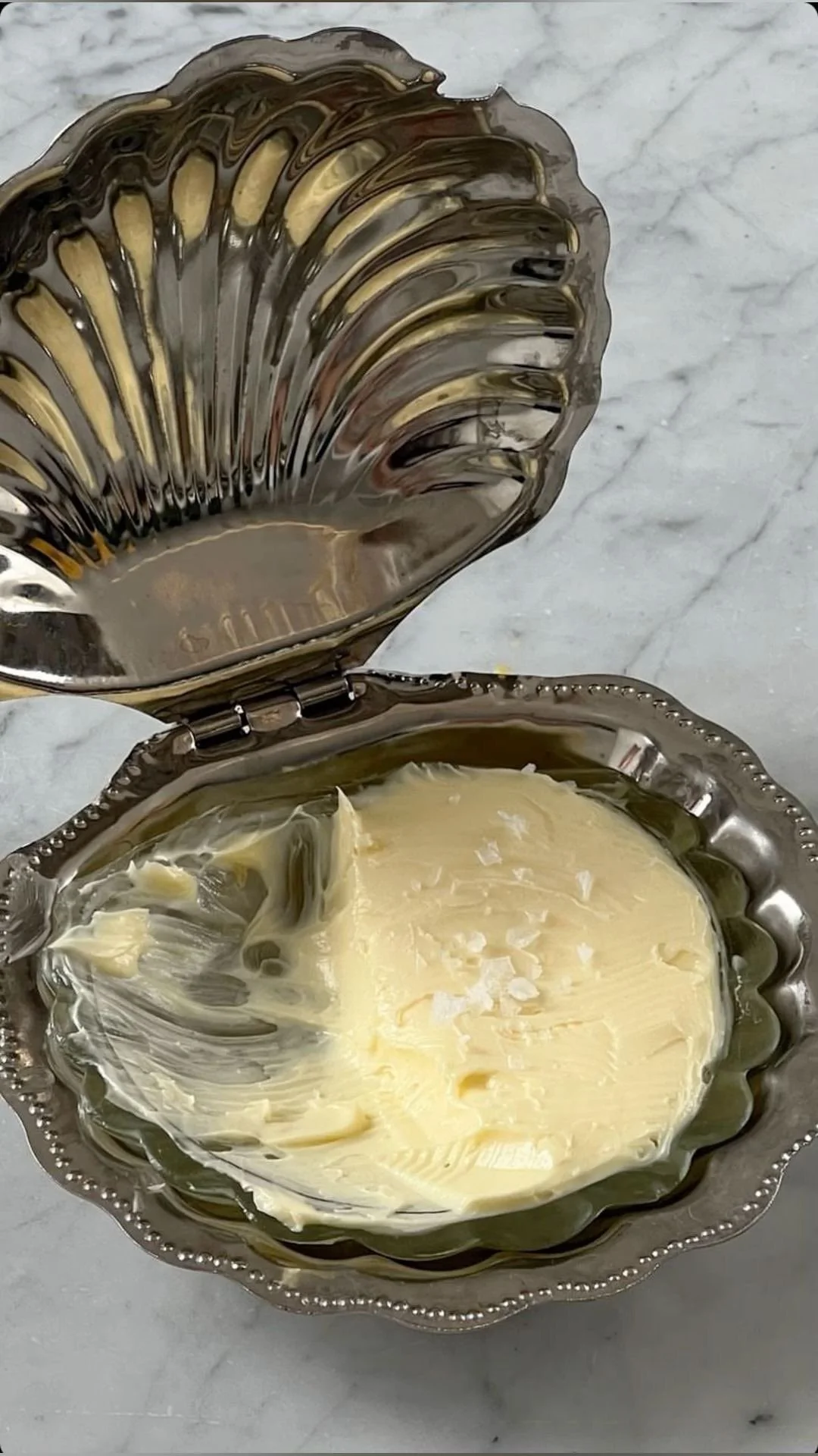 Butter in a silver shell dish