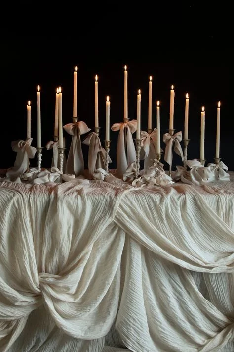 Candlelit table dressed in linen