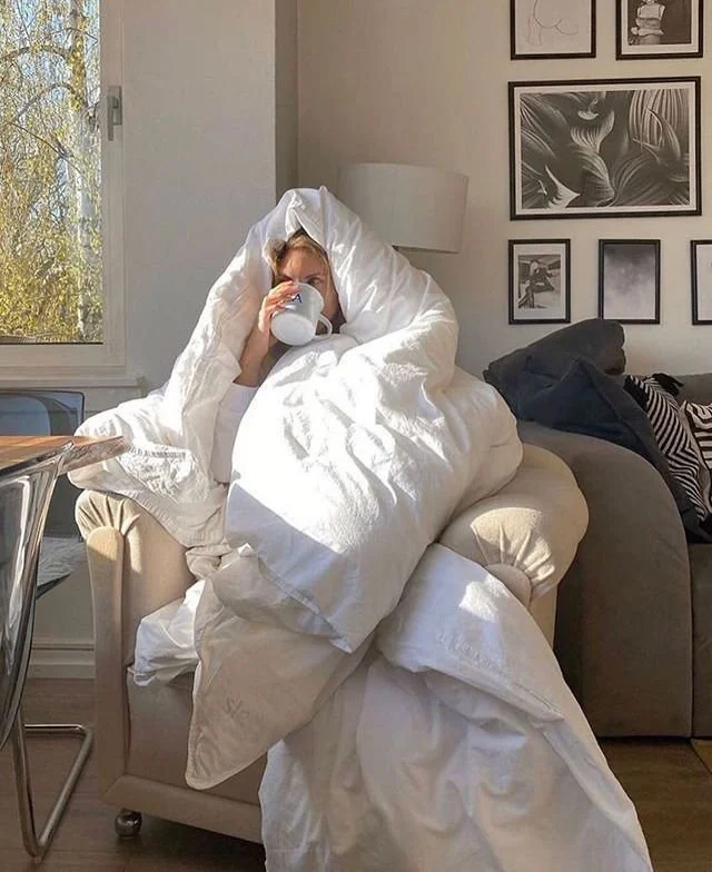 Cosy morning under a duvet with a cup of tea