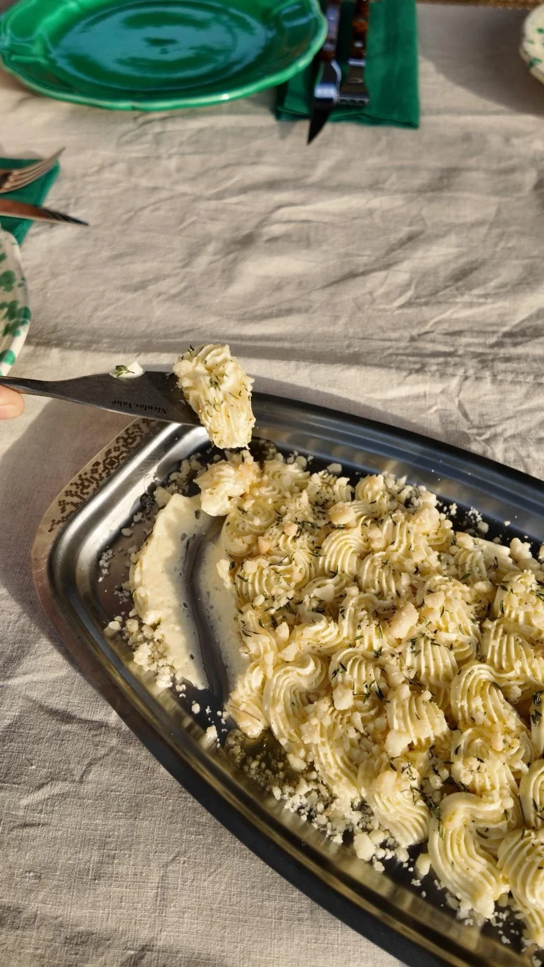 Whipped butter spread on a silver platter